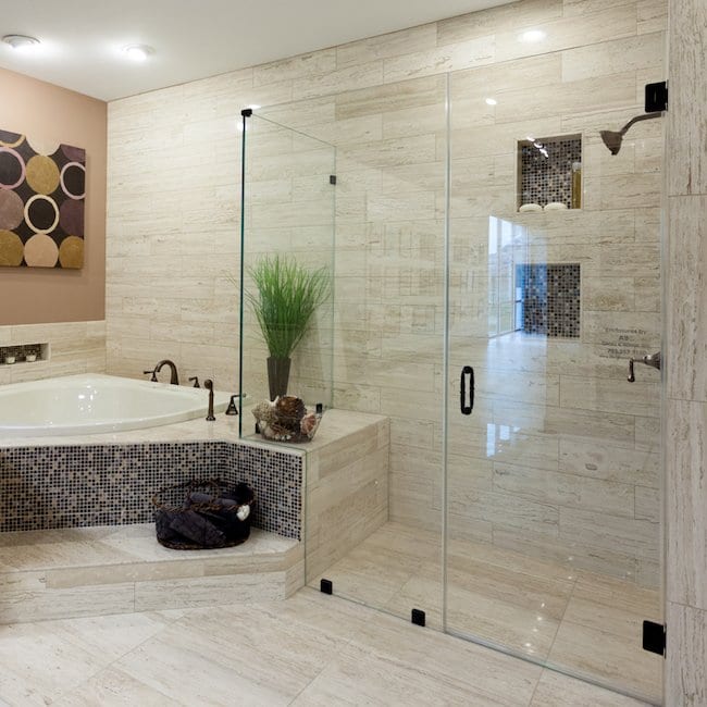 shower to the right with a bag next to the bathtub to the left