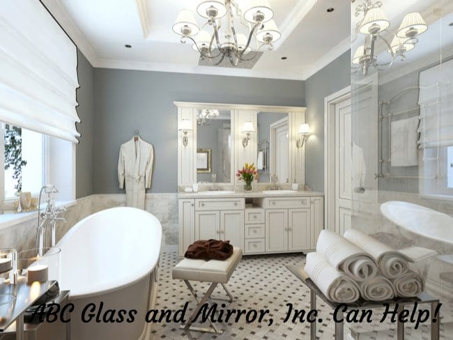 white bathroom with a bathrub to the left, towels and shower to the right, and sinks and mirrors in the middle