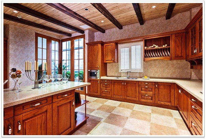 wooden kitchen with cabinets, draws and windows