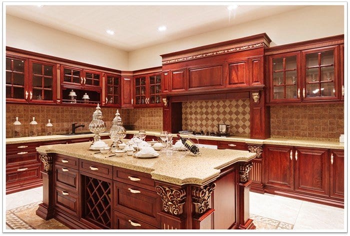 sideview of the kitchen that has wooden cabinets all around