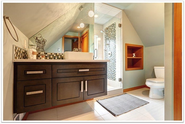 modern walk-in shower with a toilet to the left and a sink to the right