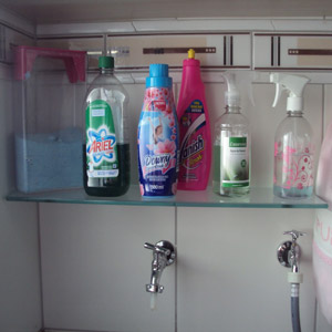 add glass shelves to modernize your laundry room