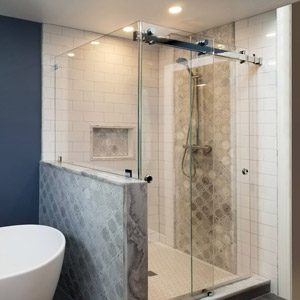 Rolling barn door frameless glass shower doors and enclosures are stylish