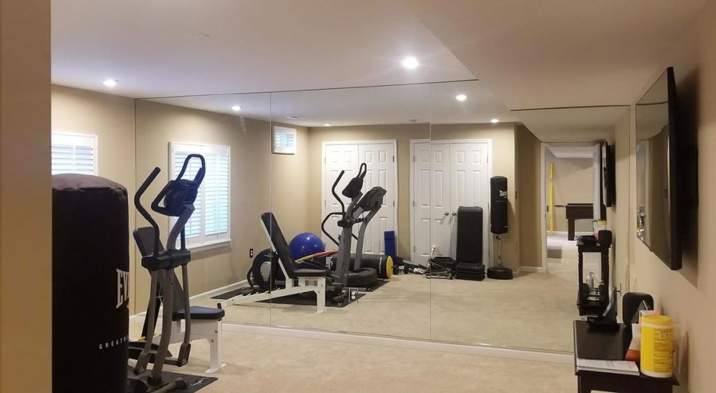 Example of full sized home glass gym mirror wall.