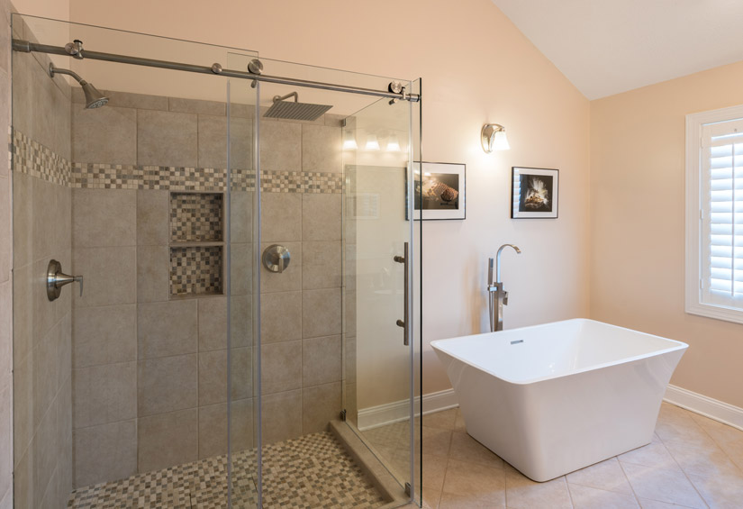 Rolling glass shower door in a bathroom