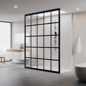 A Gridscape glass shower has black framing and mullions