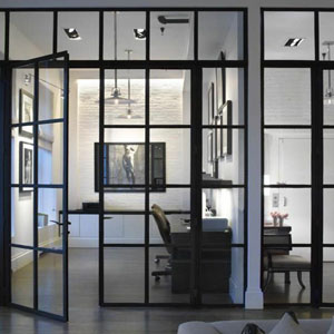 Grid style glass is surrounded by black metal and adorned with horizontal and vertical mullions