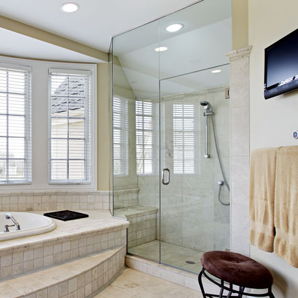 Frameless glass showers have been the product of choice for the most beautiful bathrooms. Aluminum framing is eliminated, and the enclosure is constructed with small metal clips, caulk joints, and hinges.