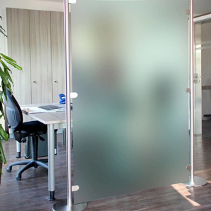 Privacy glass – glass that is frosted, patterned, or tinted – can be used to quickly create room dividers or glass doors