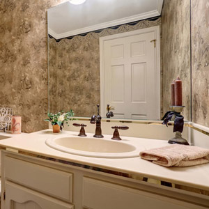 Choose a mirror that is proportional to the vanity and the room’s square footage. 