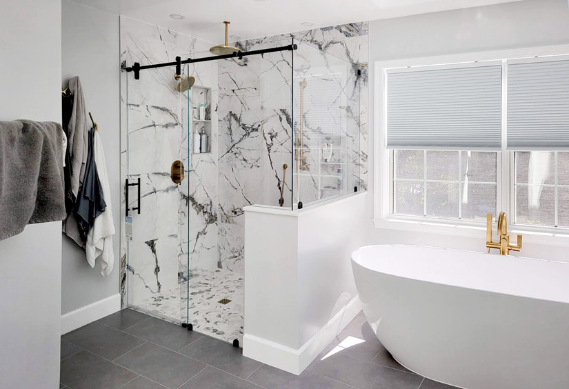 Frameless shower enclosure with marble background