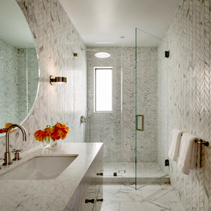 Transparent glass allows for the free flow of light between spaces; makes the shower area seem like part of the overall room; and keeps beautiful shower tiles – like marble slabs or zellige tiles – in plain view. 