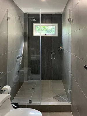 Glass shower enclosure in a small bathroom