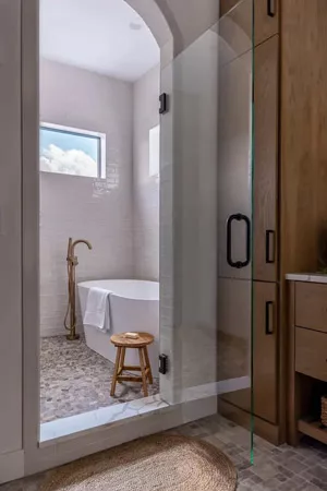  A tiny shower stall is often already enclosed on three sides. In this case, all you’ll need is one clear glass door panel and the accompanying hardware.