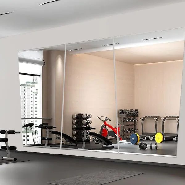 
Many of us are taking our health and wellness needs more seriously these days, so home gyms continue  to proliferate. Popular items for home workout spaces include exercise mats, free weights, foam rollers, bench press set-ups, and even mini fridges. Gym wall mirrors are another favorite product, and they add both a professional look and a boost in functionality. Working with a custom glass shop like ABC Glass & Mirror opens up many possibilities for your gym wall mirrors.

Why order custom gym mirrors instead of buying stock sheets of mirror glass?
If you buy stock gym mirrors, you have a limited choice of dimensions and have to make these work within your space.