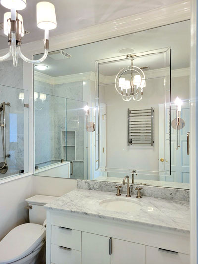 You can also make the space seem wider from side to side. Covering one wall with mirror glass optically doubles the room’s depth.