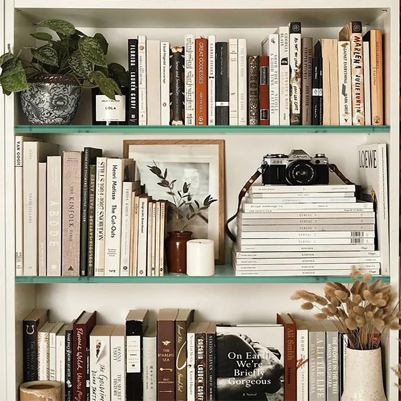 If the lack of clear parameters and steps to achieving the bookshelf wealth aesthetic makes creating your display overwhelming, remember that you can also turn to general design principles for guidance and inspiration. 