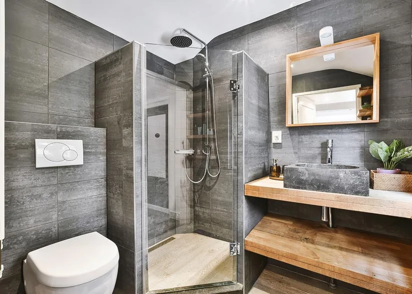 Gray themed bathroom with a new shower door.